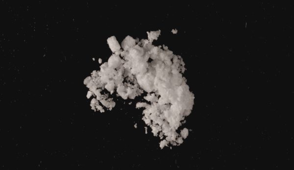 5-MeO-BFE in a crystalline powder form, displayed on a clean surface, representing a research chemical used in scientific studies.