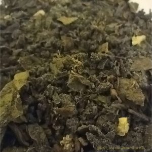 Changa, a smokable herbal blend with DMT, displayed on a clean surface, showcasing the dried herbs and earthy texture of the mixture.