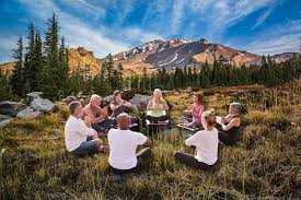 Scenic view of an Ayahuasca retreat in Italy with serene nature, ceremonial space, and participants engaged in guided healing rituals.